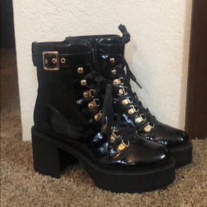 Black boots with rose gold accents